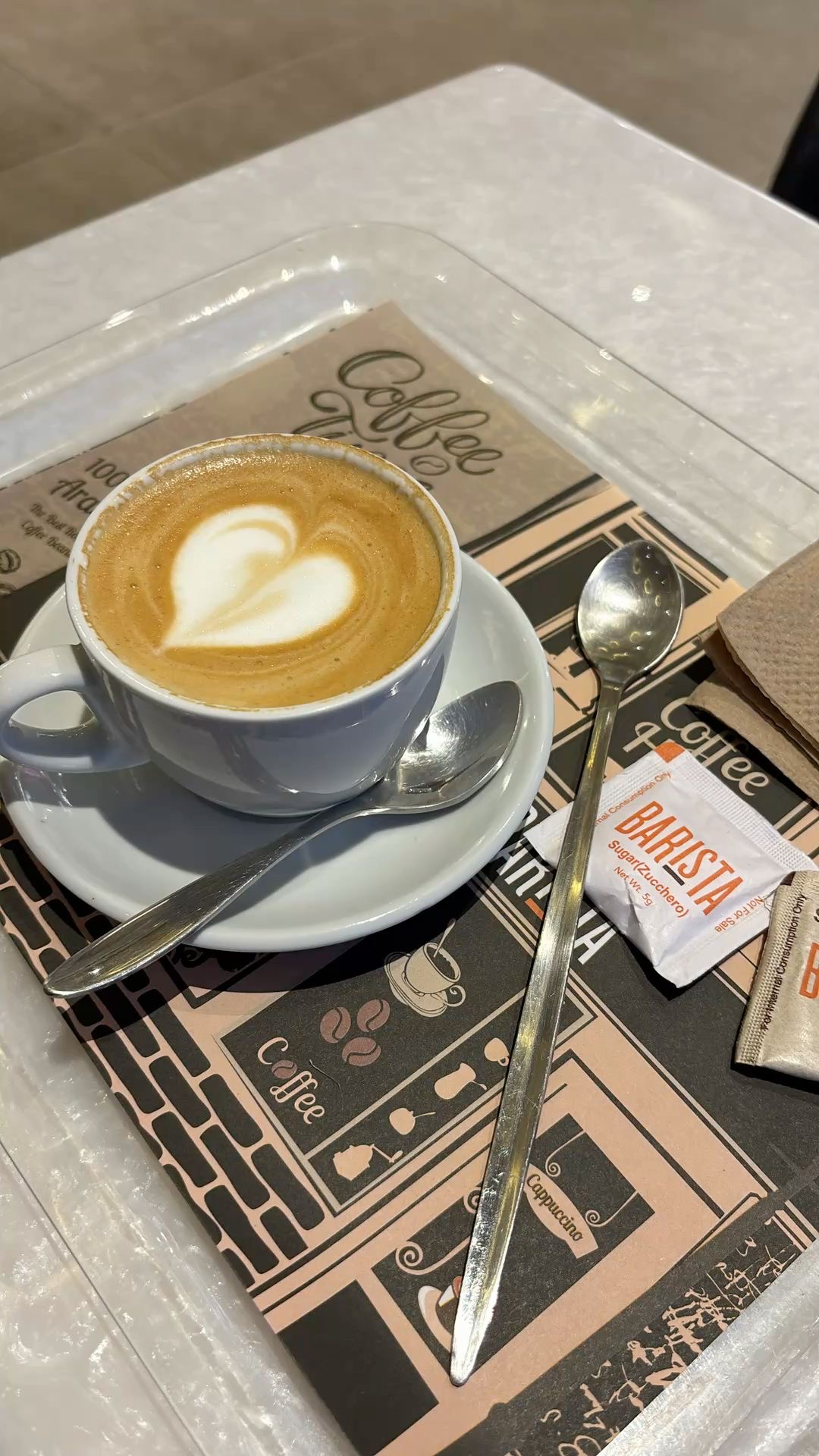 Latte with heart-shaped latte art at BARISTA NH152